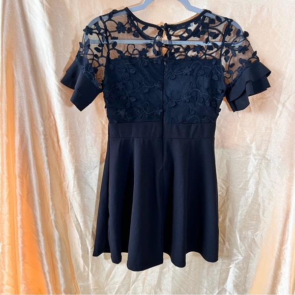 Black fit and flare floral appliqué lace top dress with butterfly sleeve accents - Picture 2 of 5